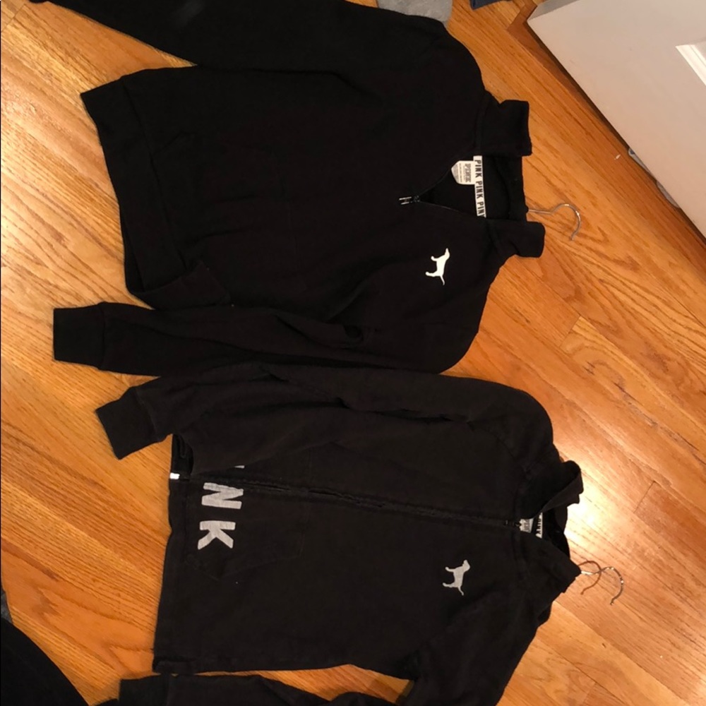 I black zip up and one black shirt.
